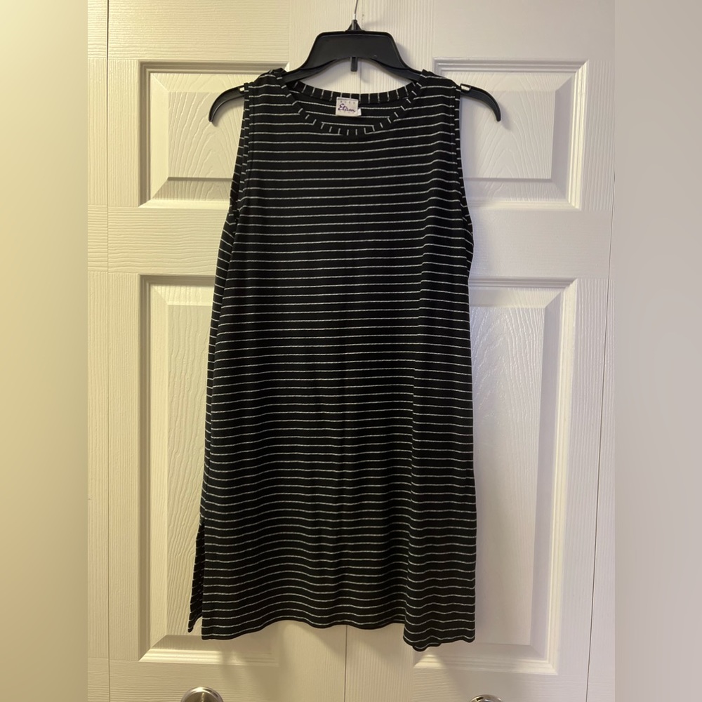 A black striped mini dress is a classic and chic choice that can be dressed up.